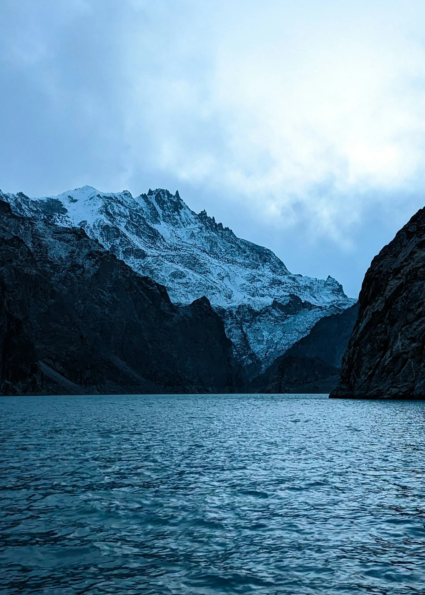 Turquoise water and the Karakoram mountains at Attabad Lake, Gilgit-Baltistan.